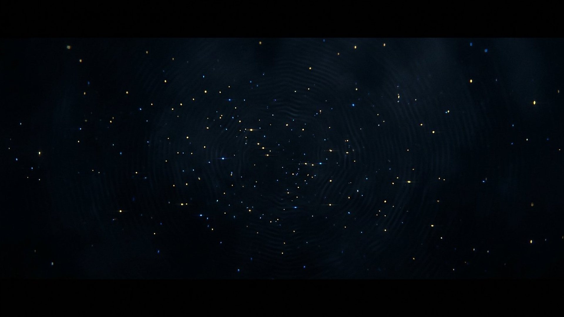 Vide sombre parcouru de minuscules lueurs fugaces.